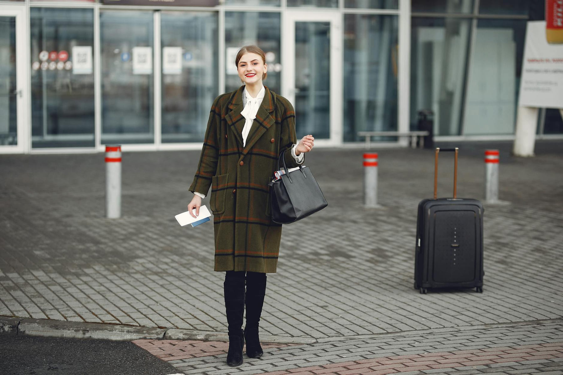 Fashionable woman with luggage arrives at airport ready for travel. on Points and Pathways