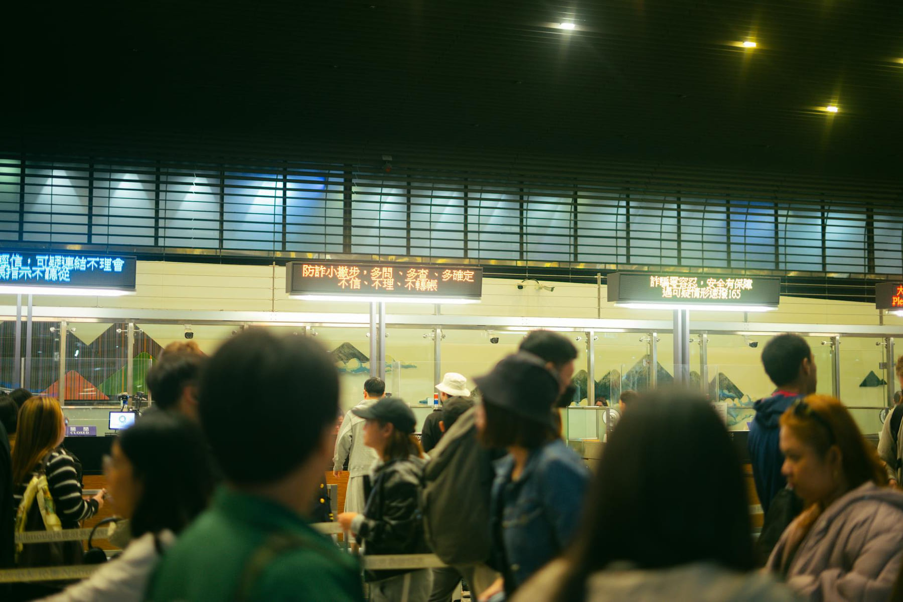 Crowded airport check-in area with people queueing and visible flight information signs. on Points and Pathways