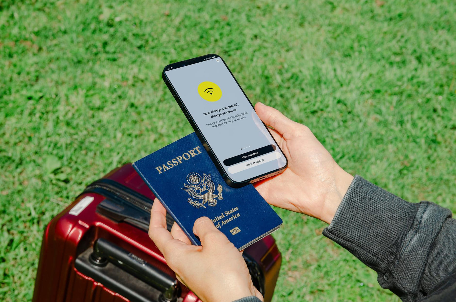 Close-up of hands holding a passport and smartphone with lost connection outdoors beside luggage. on Points and Pathways