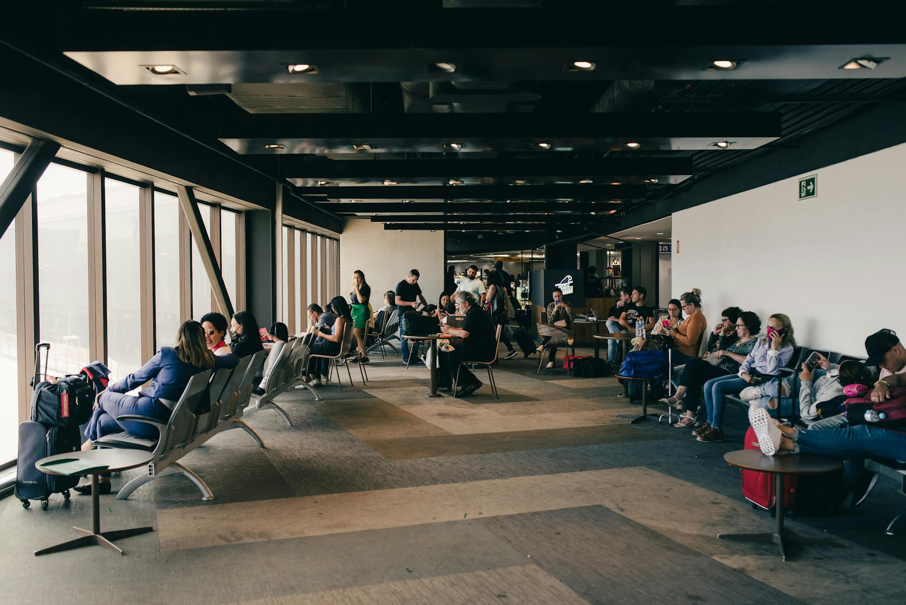 Passengers relaxing in a São Paulo airport waiting area, capturing a travel moment. on Points and Pathways